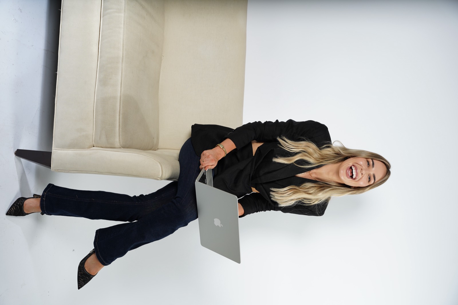 Ella laughing with laptop