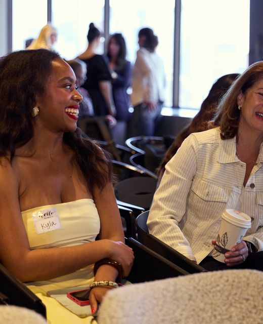 Women founders laughing in the audience at NY Tech Week